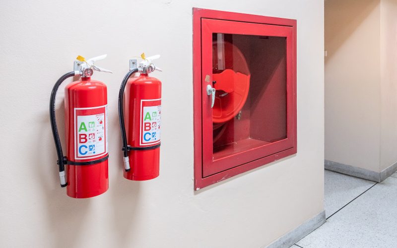 Fire extinguisher system on the wall background,